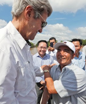 'I'm glad we're both alive': John Kerry and Vo Ban Tam.