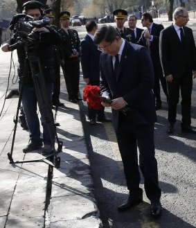 Turkish Prime Minister Ahmet Davutoglu lays carnations near the site of Wednesday's explosion.