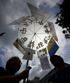 A protesters holds a banner during an anti-nuclear rally in front of Prime Minister Shinzo Abe's official residence on Tuesday.