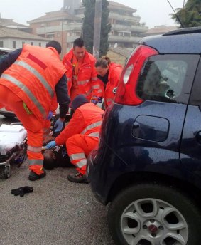 Italian paramedics treat a wounded man.