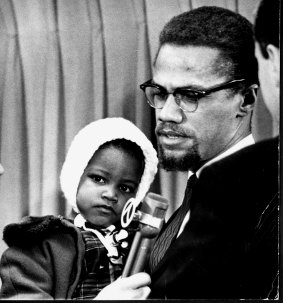 Malcolm X with his daughter, Ilyasah Shabazz in 1964.