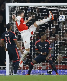 Arsenal's Olivier Giroud jumps for the ball during the Champions League 2-0 match between Arsenal and Bayern Munich at Emirates stadium.