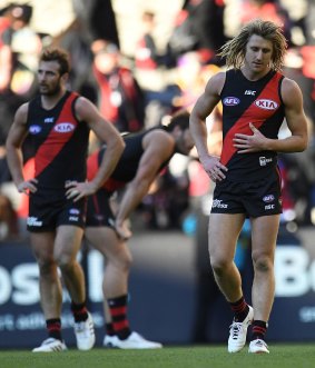 Sad and sorry: Jobe Watson and Dyson Heppell after losing to the Lions.