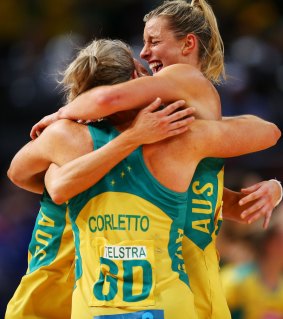 Australia's defenders embrace.