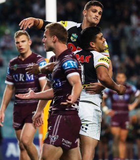 Rubbing it in: The Panthers celebrate the contentious try.