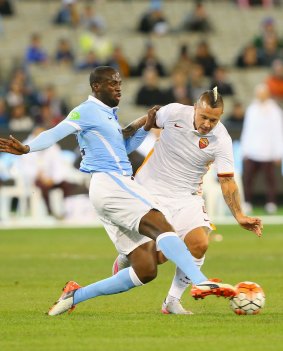 Yaya Toure of Manchester City and Radja Nainggolan of AS Roma compete for the ball. The two midfielders battled throughout the game.