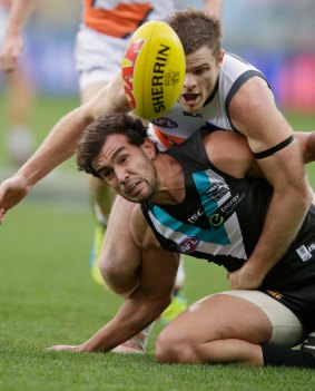 Heath Shaw tackles Port Adelaide's Brendon Ah Chee.