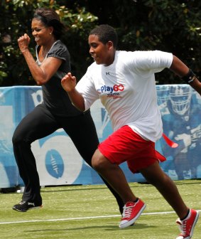 Michelle Obama runs as she participates in the Let's Move! Campaign when she was first lady.