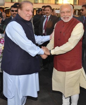 Indian Prime Minister Narendra Modi, right, shakes hands with his Pakistani counterpart, Nawaz Sharif, in Lahore, Pakistan, on Christmas Day. 