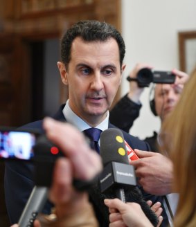 Syrian President Bashar Assad speaks to French journalists, according to this photo released by the Syrian official news agency SANA.