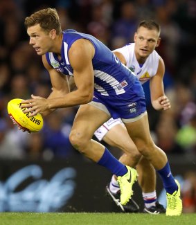The Kangaroos' Shaun Higgins in action in the Good Friday match against the Western Bulldogs at Etihad Stadium.