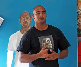 Myuran Sukumaran in Kerobokan prison with one of his self portraits.