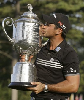 Sweet success: Jason Day kisses the Wanamaker Trophy after winning the PGA Championship in August.