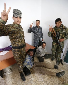 Islamic State militants captured by Shiite paramilitary forces in Tikrit in April. 