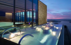 The Burgenstock Resort's infinity pool hovers between sky and lake.