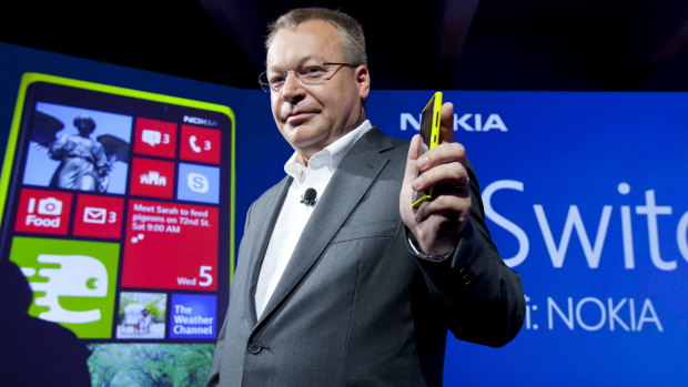 Nokia chief executive Stephen Elop with the company's smartphones, which run on Microsoft Windows Phone.