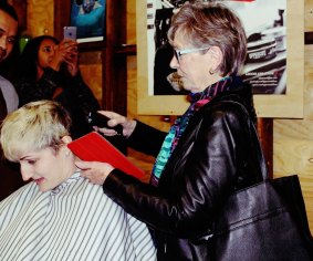 Shelley West at The Barber Shop in Braddon as her grandmother Sue Davis takes up the clippers. 