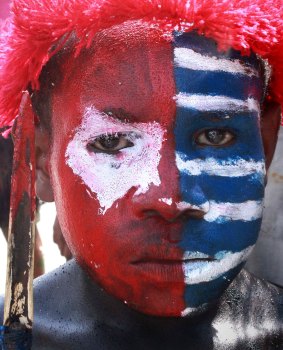 Split: A Papuan's face is painted the colour of the banned separatist flag. Reporting from the region has been restricted since it became part of Indonesia in 1969.