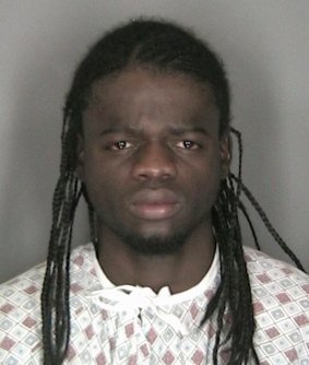 DNA left on pizza crust, according to police ... Murder suspect Daron Dylon Wint is pictured in this 2007 police booking photograph released on Friday. 
