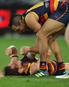  Richard Douglas celebrates a goal with Eddie Betts in Adelaide’s win.  