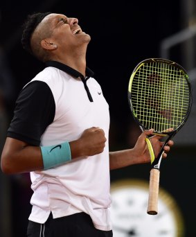 Best win: Nick Kyrgios celebrates his victory over Roger Federer in Madrid.