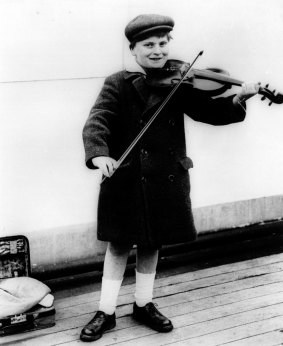 Menuhin playing violin in 1927.  