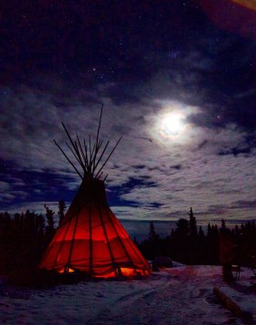 Guests can await the arrival of the lights in by the warmth of a fire inside a teepee.