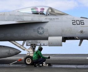 Four steam-powered cable catapults onboard can fire one F/A-18 Super Hornet into the air every minute.
