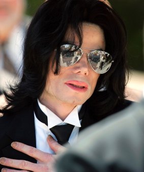 Michael Jackson gestures as he leaves court during his trial on child molestation charges in 2005.