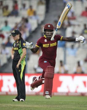 Deandra Dottin throws the bat skyward after the West Indies won the tournament with just three balls to spare. 