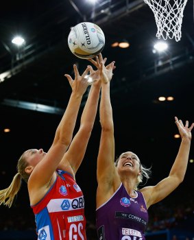 BRISBANE, AUSTRALIA - JULY 31:  Caitlin Thwaites of the swifts competes for the ball with Laura Geitz of the firebirds during the 2016 ANZ Championship Grand Final match between the Queensland Firebirds and the NSW Swifts at Brisbane Entertainment Centre on July 31, 2016 in Brisbane, Australia.  (Photo by Jason O'Brien/Getty Images)