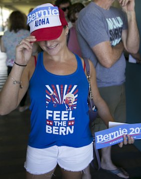 Hawaii voter Noelle Giambalvo shows off her Bernie Sanders' swag while waiting in line at the Hawaii caucus at Kailua Intermediary School.