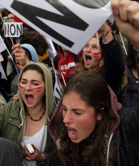 Youth shout slogans during a Paris demonstration against changes to the labour laws.
