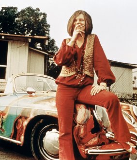 American singer-songwriter Janis Joplin (1943 - 1970) with her 1965 Porsche 356C Cabriolet, circa 1969. 