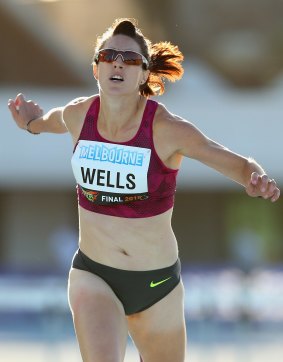 Lauren Wells competes in the women's 400m hurdles on Saturday.