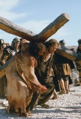 Tough gig ... Jarreth Merz who plays Simon of Cyrene, right, helping actor Jim Caviezel, portraying Jesus Christ
