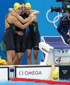 Australia's Emma McKeon, Brittany Elmslie and Bronte Campbell celebrate gold in the 4 by 100m freestyle relay at the Rio Olympics.
