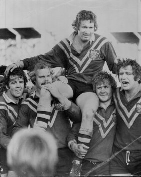 Lifting spirits: Graeme Langlands is hoisted by teammates at the SCG vs England in 1974.