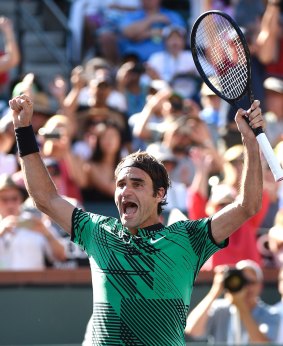Roger Federer enjoys the moment after defeating Stan Wawrinka in the men's final of the BNP Paribas Open at Indian Wells.