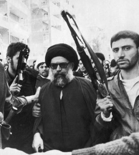 Lebanese Shiite leader Mohammed Hussein Fadlallah is flanked by bodyguards in March 1985 as he attends a funeral ceremony in Beirut for more than 75 people killed in an attempt on his life. The attack is believed to have been carried out by Saudi agents at the CIA's instigation.