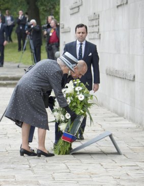 Queen Elizabethand Prince Philip lay a wreath at the inscription wall during their visit to the former Bergen-Belsen concentration camp on Friday.