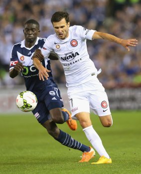 Canberra's Jason Geria of the Victory and Labinot Haliti compete for the ball in round one of the A-League season.