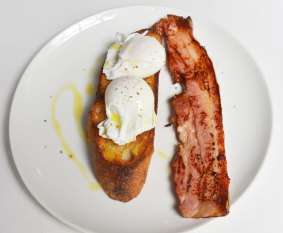 Poached eggs on toast with thick-cut bacon at Pei Modern.