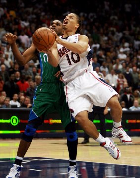 To the hoop: Tyronn Lue drives past Jerry Stackhouse while playing for Atlanta against Dallas in 2007.