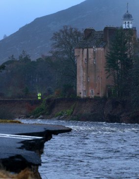 Abergeldie Castle sits precariously on the edge of the River Dee after a storm surge swept away the river bank.