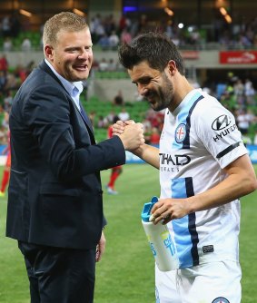 Adelaide United coach Josep Gombau shakes hands with David Villa after the game.