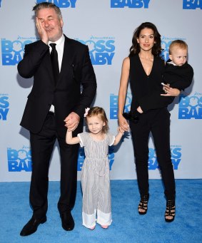Alec Baldwin poses with his wife and children.