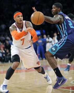 Offensive weapon: Carmelo Anthony dishes off a pass against Charlotte.