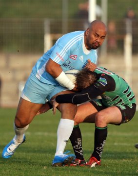 Twilight years of his career: Jonah Lomu is tackled by Montmelian's Guillaume Cognard, during their Federale One rugby union match between Marseille-Vitrolles, his new club, and Montmelian, in Vitrolles, in 2009. 