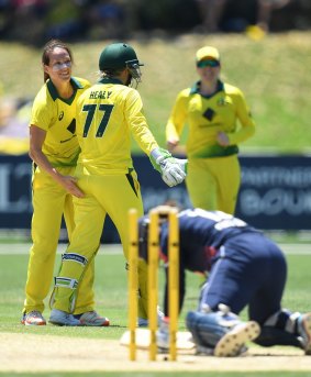 Got her: Megan Schutt (left) celebrates the wicket of Tammy Beaumont - her new-found teammate.